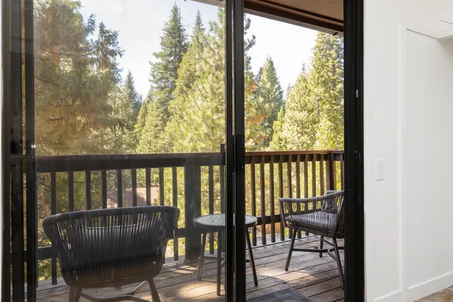 a view of balcony with furniture