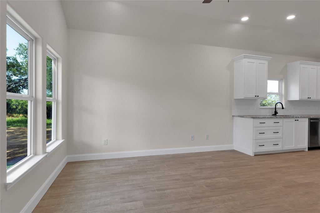 815 Southwest 28th Street Mineral Wells, TX 76067 - Photo 11 of 40 a room with furniture and window