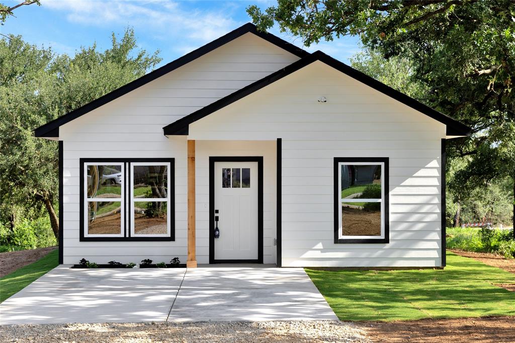 815 Southwest 28th Street Mineral Wells, TX 76067 - Photo 2 of 40 a view of house with backyard