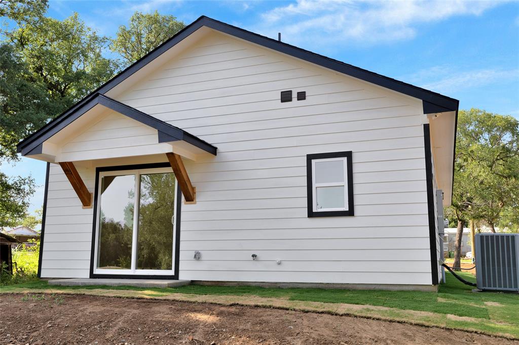 815 Southwest 28th Street Mineral Wells, TX 76067 - Photo 40 of 40 a front view of a house with a yard