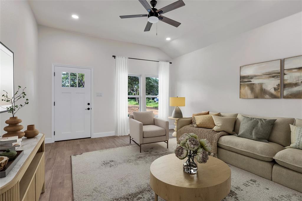 815 Southwest 28th Street Mineral Wells, TX 76067 - Photo 9 of 40 a living room with furniture and a large window