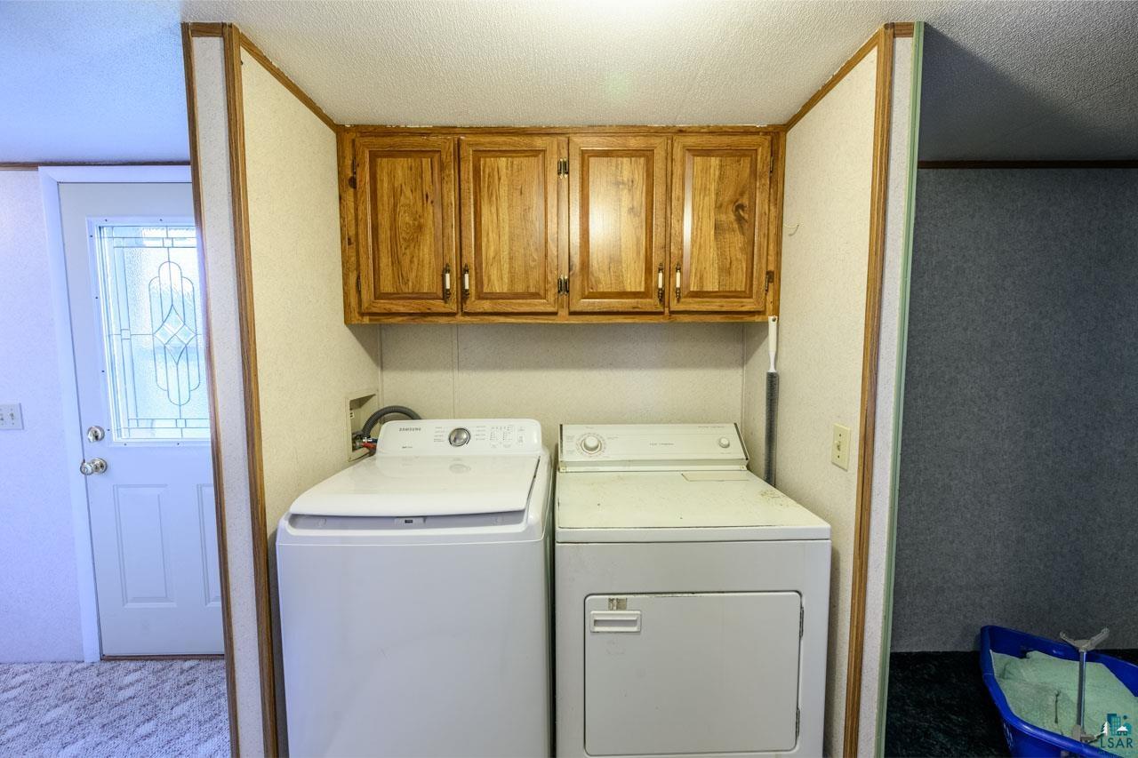 705 4th Street North Biwabik, MN 55708 - Photo 13 of 29 Dedicated laundry area featuring wood-finish cabinetry for storage