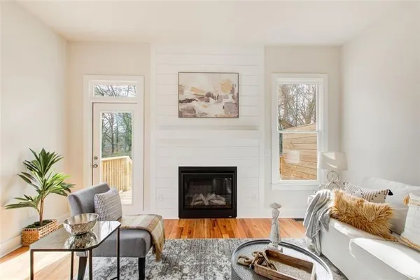 a living room with furniture and a fireplace