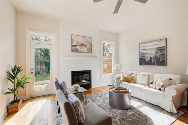 a living room with furniture and a fireplace