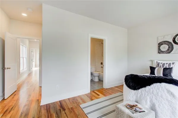 a bedroom with a bed and dresser