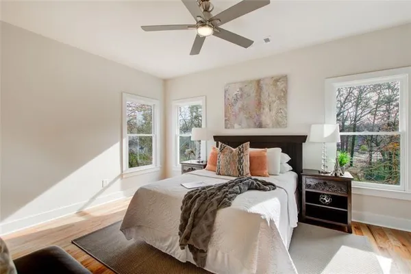 a bedroom with a large bed and a window