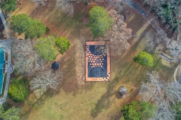 an aerial view of a house with a yard