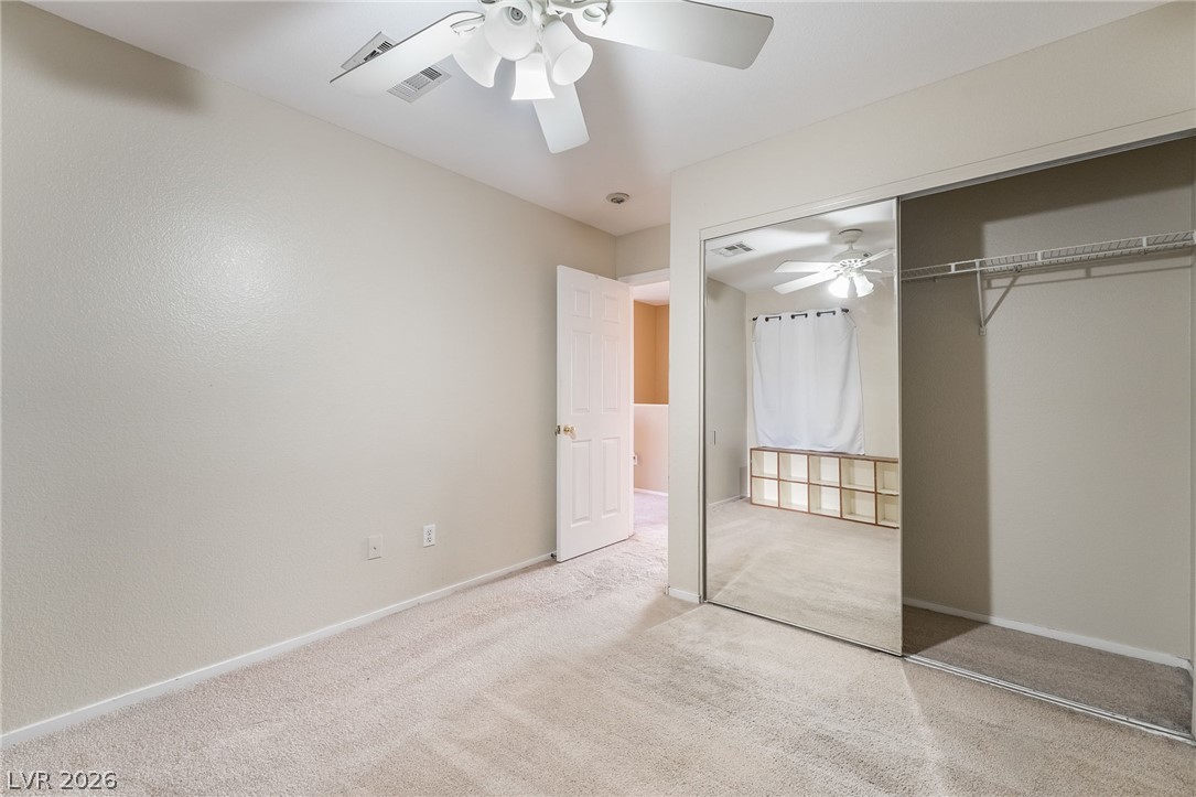 224 Positive Point Street Henderson, NV 89012 - Photo 35 of 44 A quiet bedroom offers soft carpeting and a spacious sliding mirror closet.