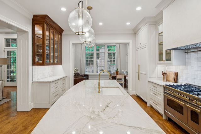 a view of bathroom with a shower and closet