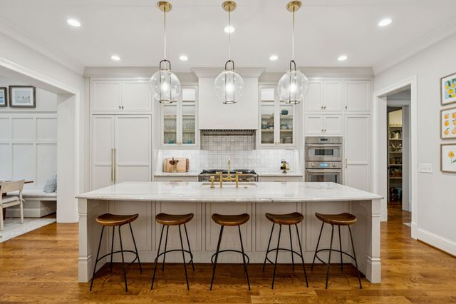 a white bath tub sitting next to a shower