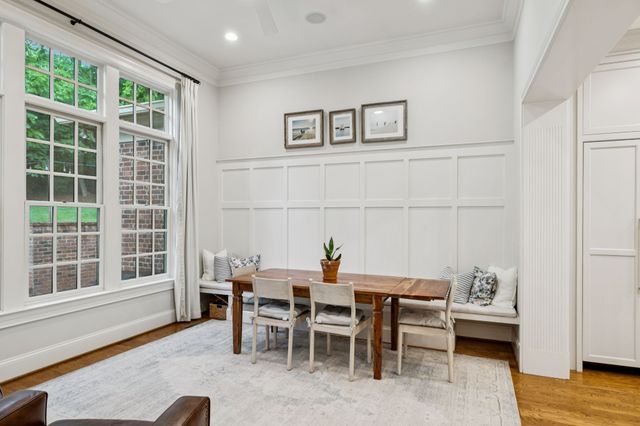 a view of a livingroom with workspace and a window