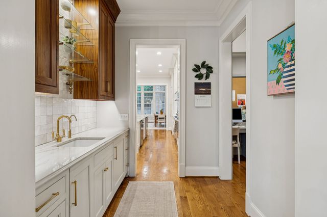 a bedroom with furniture and a flat screen tv