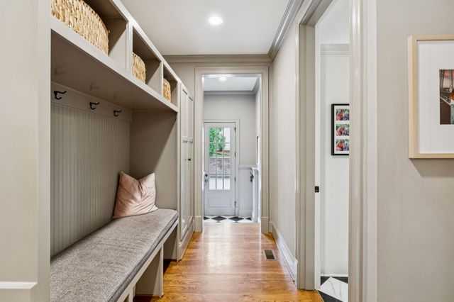 front view of a house with a yard and sitting area