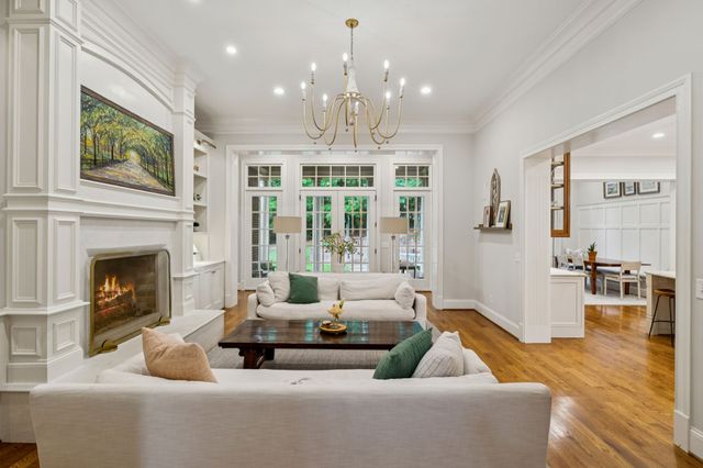 a bathroom with sink shower and mirror