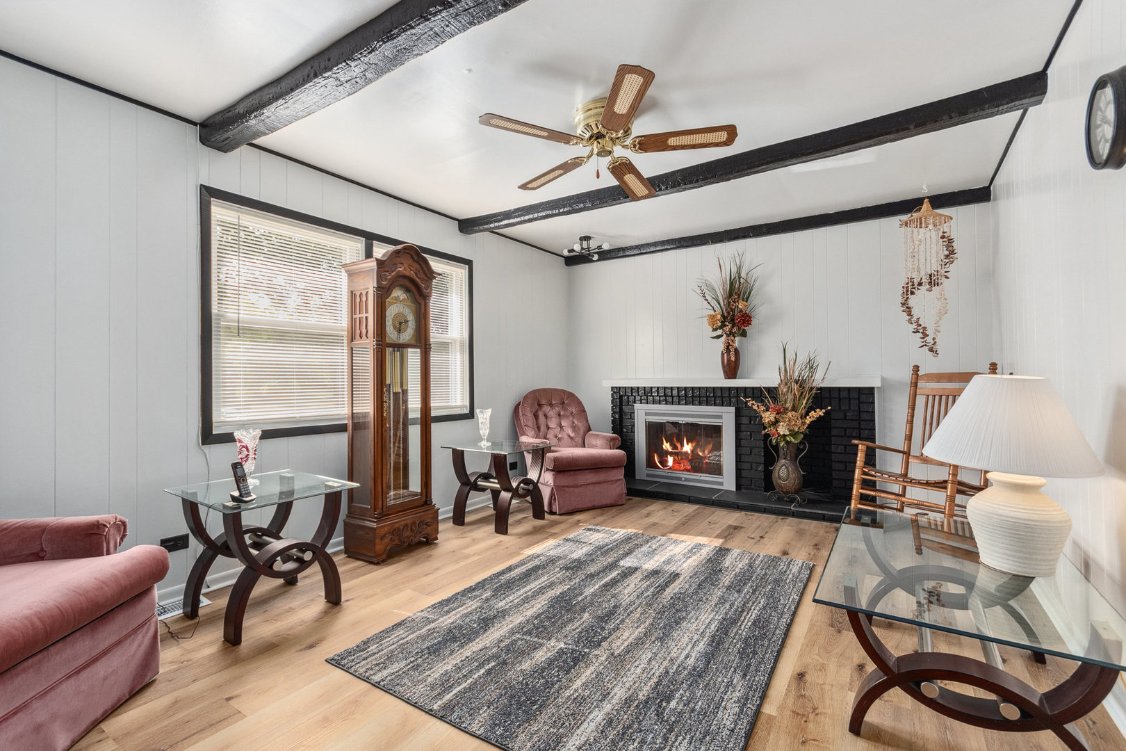 230 Ridgefield Lane Naperville, IL 60565 - Photo 12 of 26 a living room with furniture a fireplace and a table