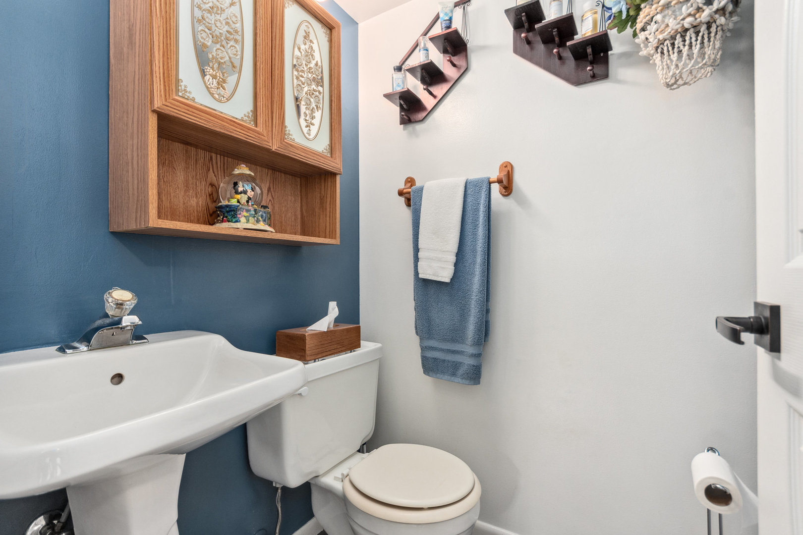 230 Ridgefield Lane Naperville, IL 60565 - Photo 13 of 26 a white toilet sitting next to a bathroom sink