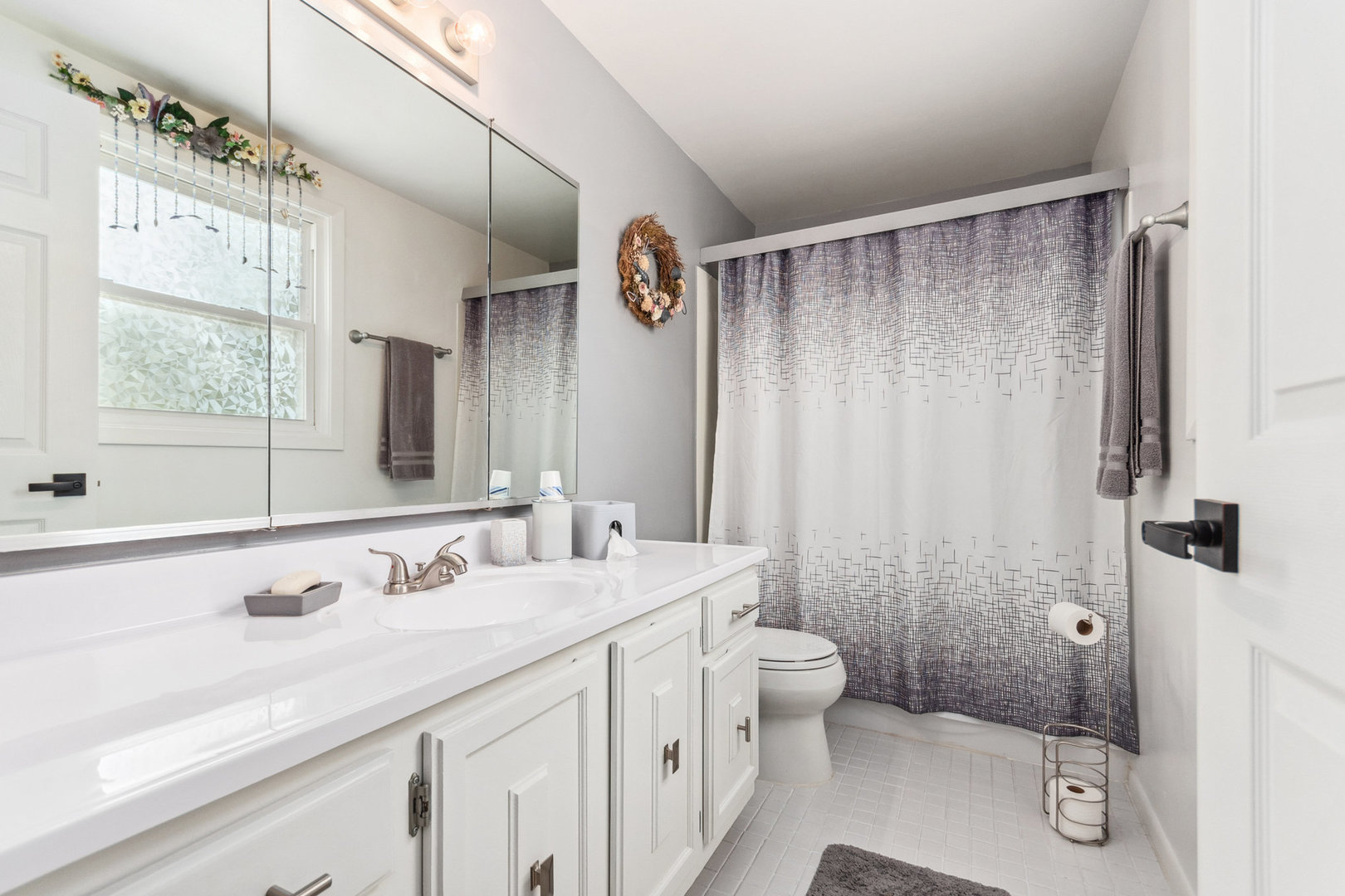 230 Ridgefield Lane Naperville, IL 60565 - Photo 15 of 26 a bathroom with a double vanity sink toilet mirror and shower