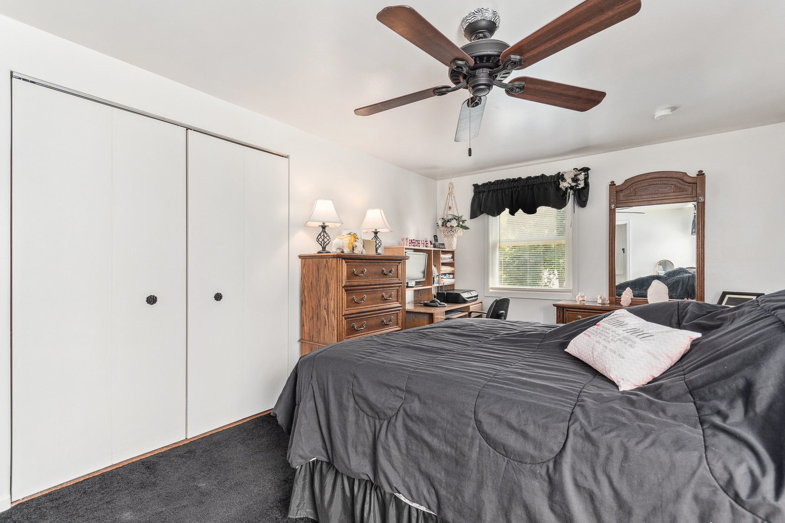 230 Ridgefield Lane Naperville, IL 60565 - Photo 17 of 26 a bed room with a bed and a ceiling fan