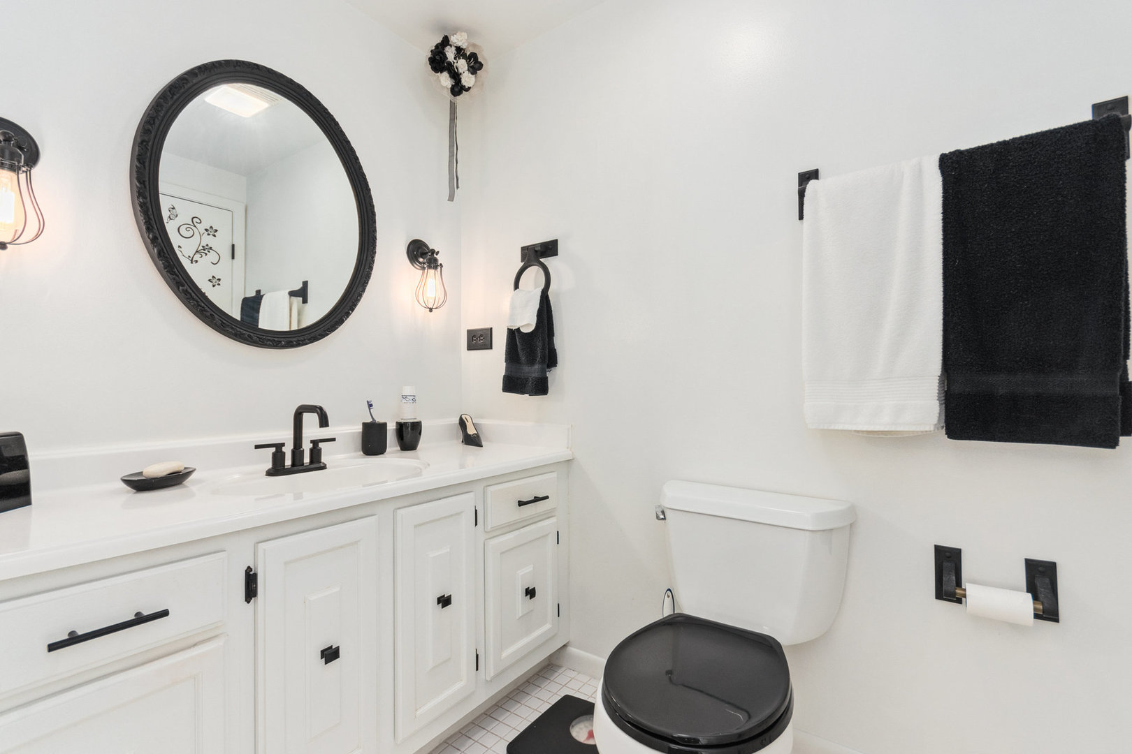 230 Ridgefield Lane Naperville, IL 60565 - Photo 18 of 26 a bathroom with a toilet a sink and a mirror