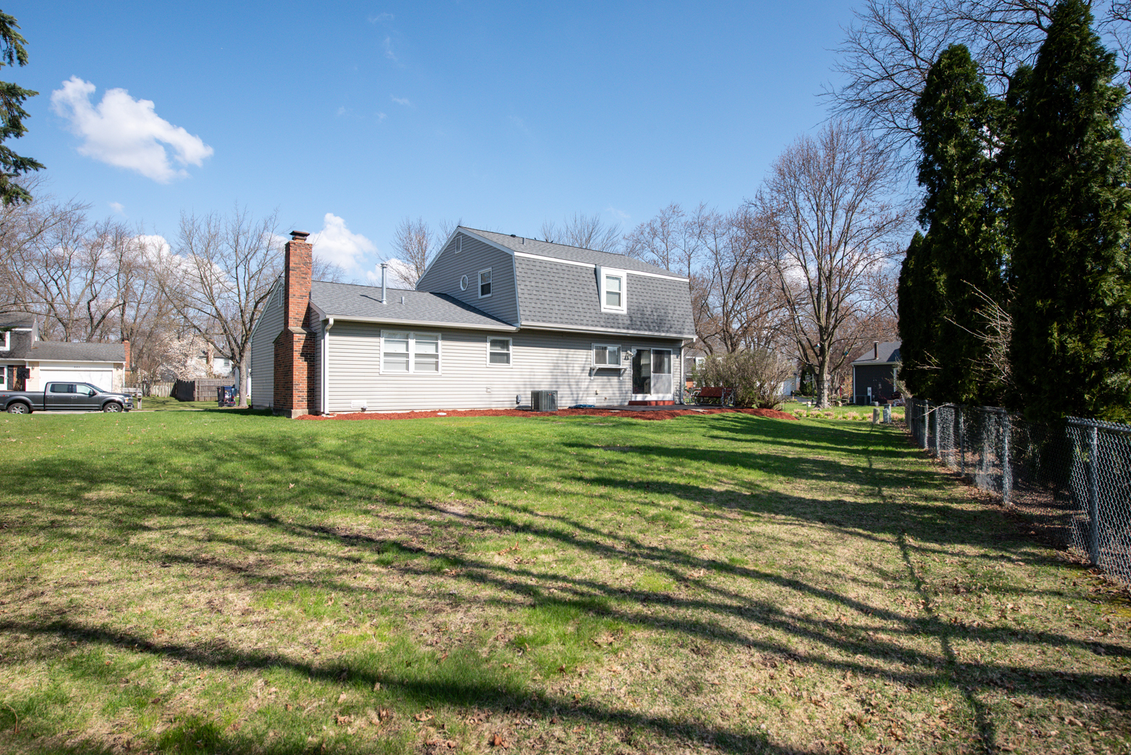 230 Ridgefield Lane Naperville, IL 60565 - Photo 24 of 26 a front view of a house with a yard