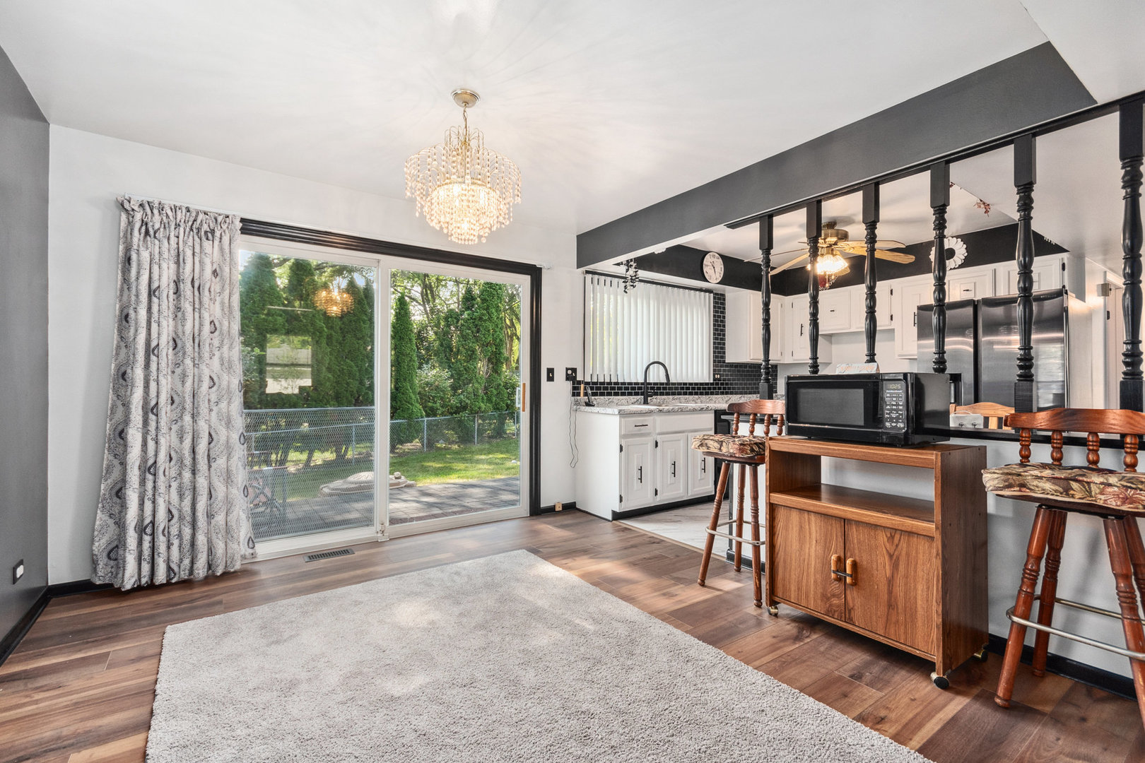 230 Ridgefield Lane Naperville, IL 60565 - Photo 5 of 26 a kitchen that has a lot of cabinets and wooden floor