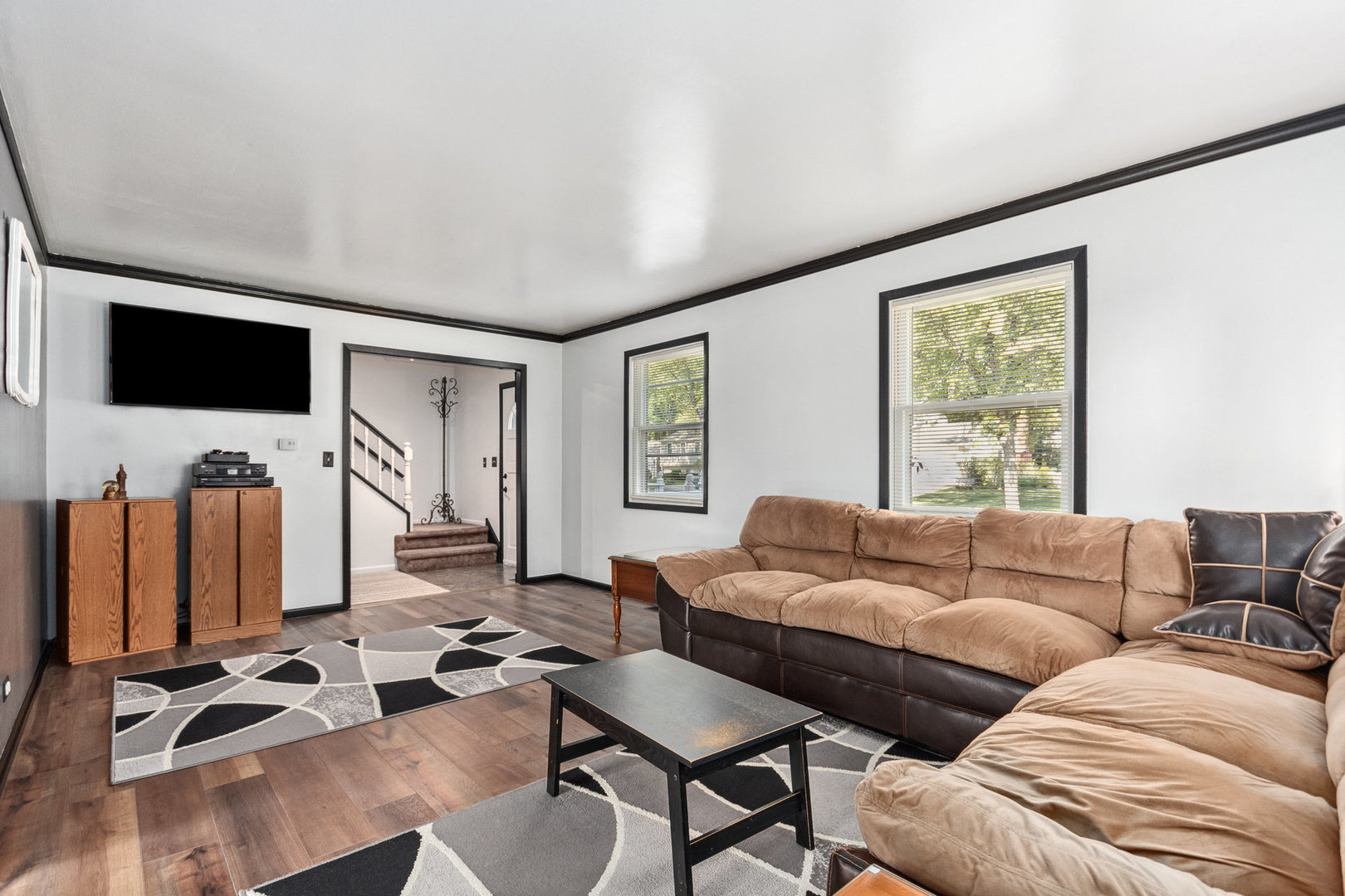 230 Ridgefield Lane Naperville, IL 60565 - Photo 9 of 26 a living room with furniture and a flat screen tv