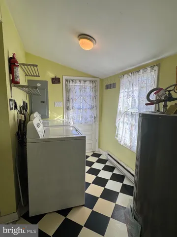 a kitchen with a refrigerator and a sink