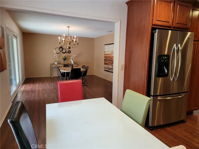 a kitchen with sink refrigerator and cabinets