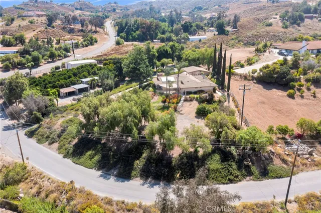 a view of a street with a yard