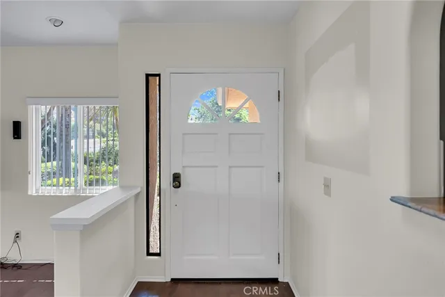 a view of an entryway with wooden floor