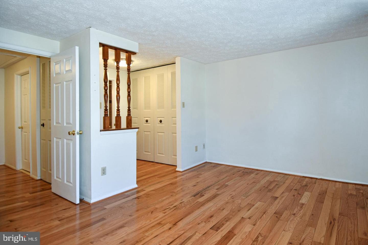 8417 Cedar Falls Court Springfield, VA 22153 - Photo 18 of 34 a view of an empty room with wooden floor and a window