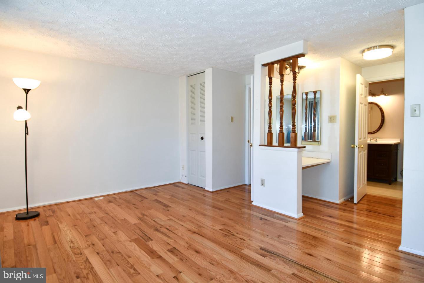 8417 Cedar Falls Court Springfield, VA 22153 - Photo 20 of 34 a view of a room with wooden floor and cabinet