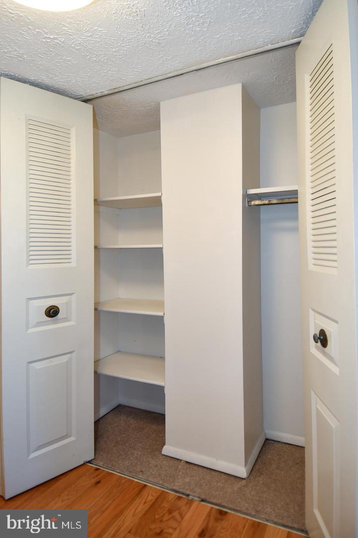 8417 Cedar Falls Court Springfield, VA 22153 - Photo 21 of 34 a view of walk in closet with empty racks