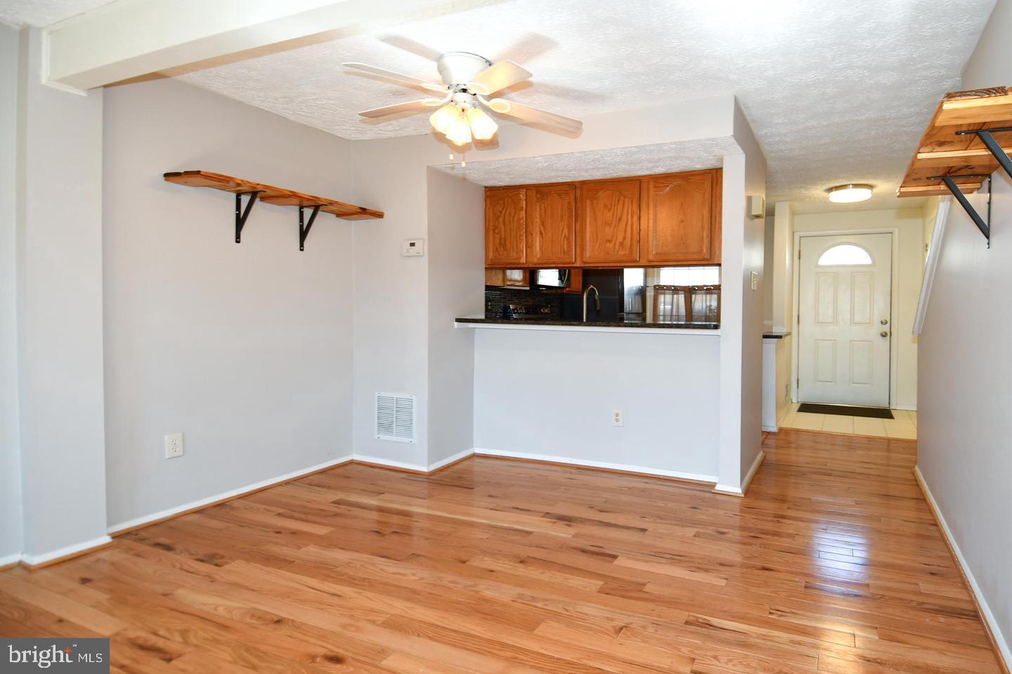 8417 Cedar Falls Court Springfield, VA 22153 - Photo 4 of 34 a view of a room with a window and a ceiling fan