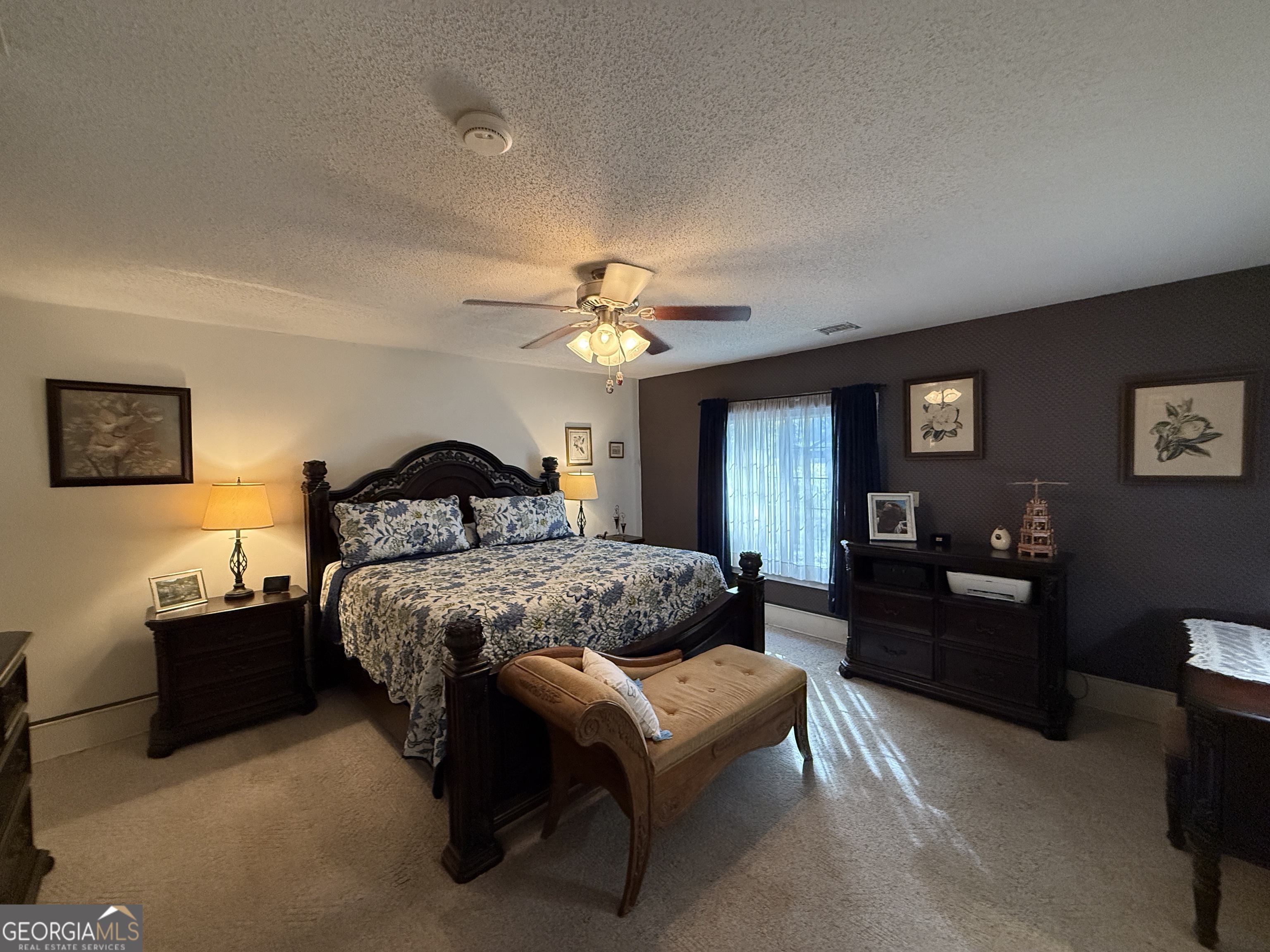 219 North College Street Pembroke, GA 31321 - Photo 12 of 24 a spacious bedroom with a bed and dresser