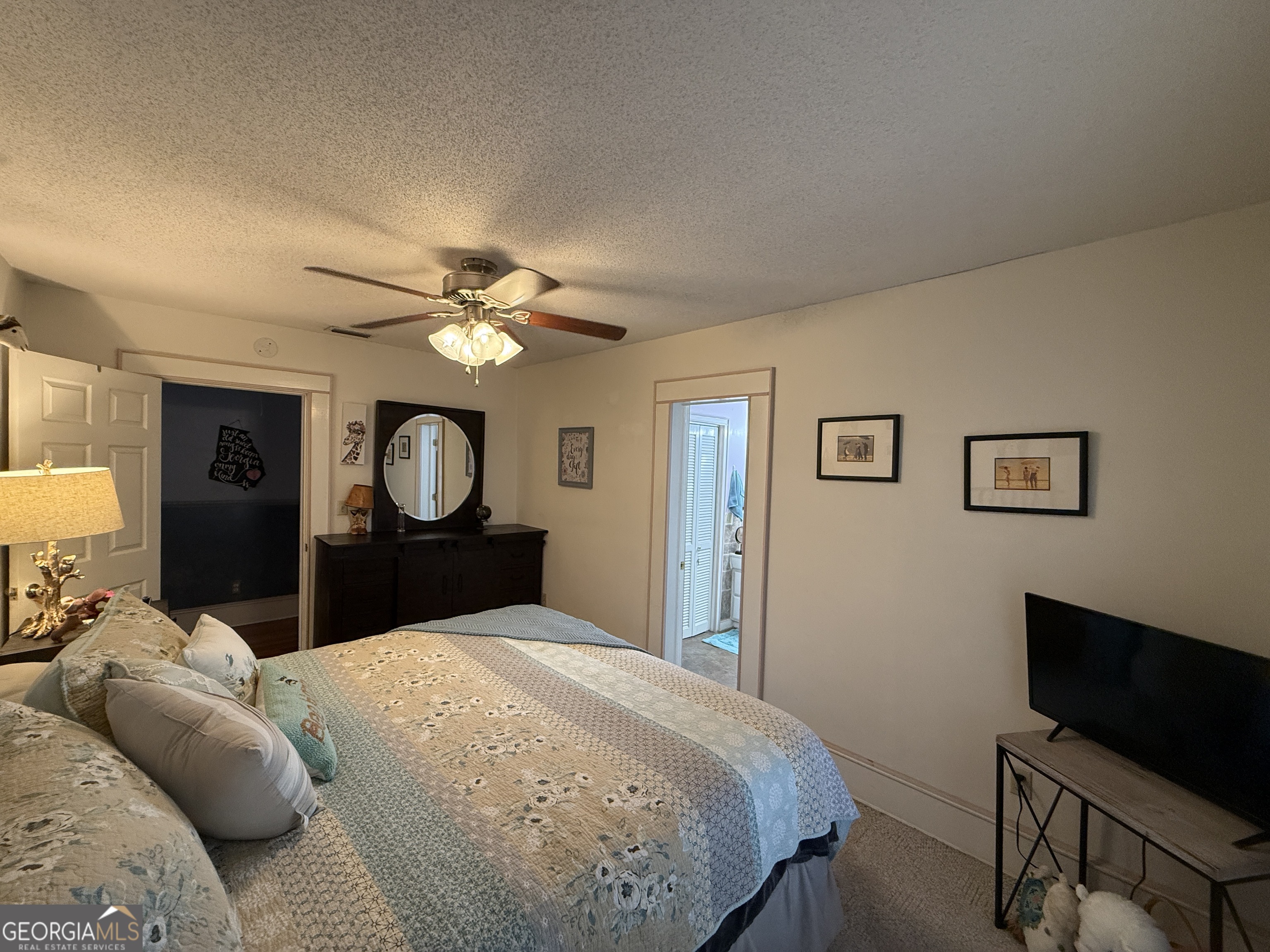 219 North College Street Pembroke, GA 31321 - Photo 16 of 24 a bedroom with a bed and a tv