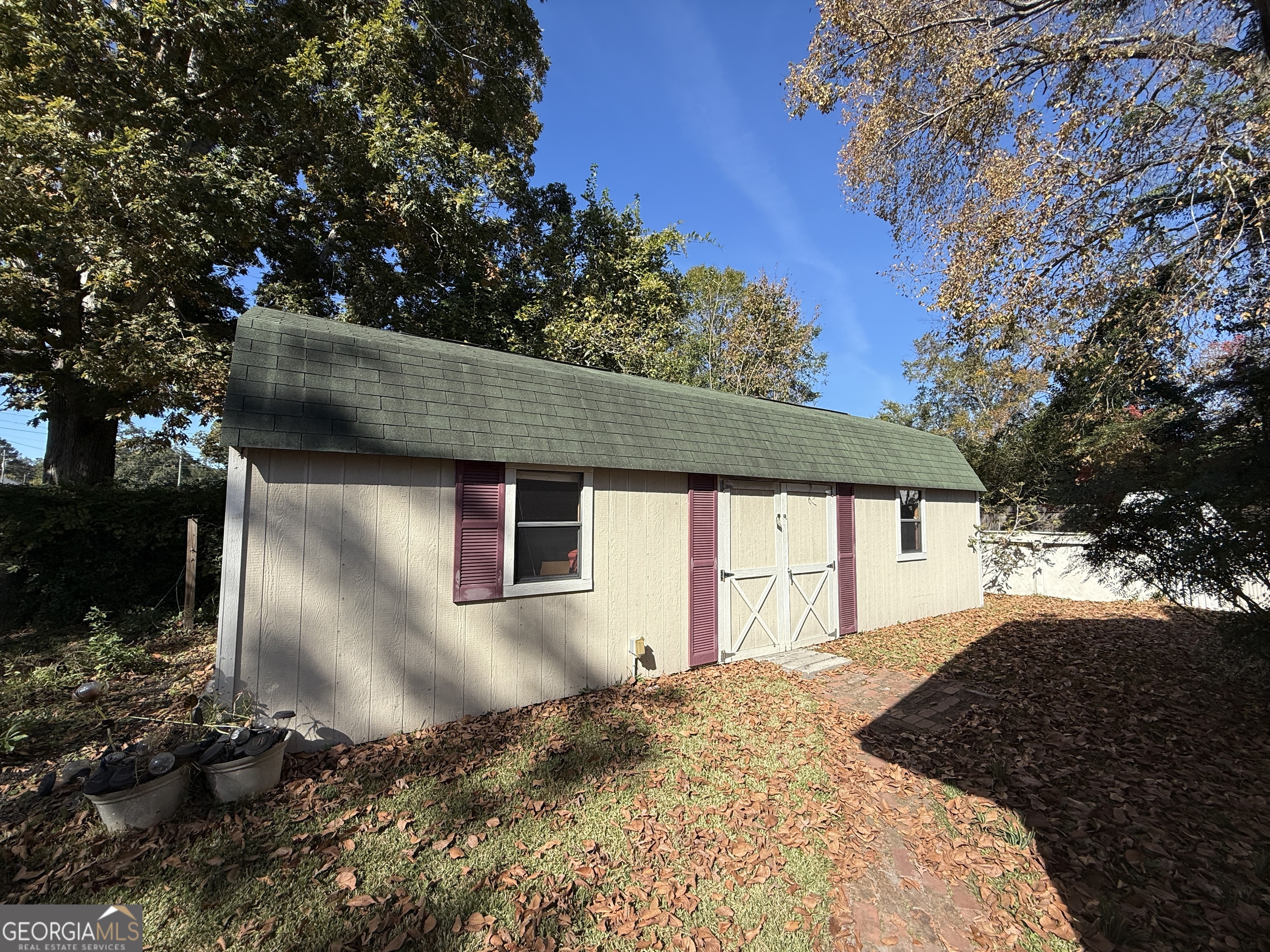 219 North College Street Pembroke, GA 31321 - Photo 20 of 24 a front view of a house with a yard