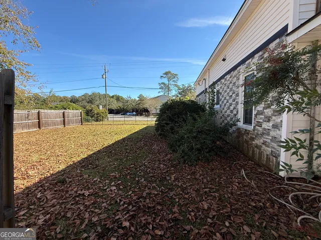 a view of a yard with an outdoor space