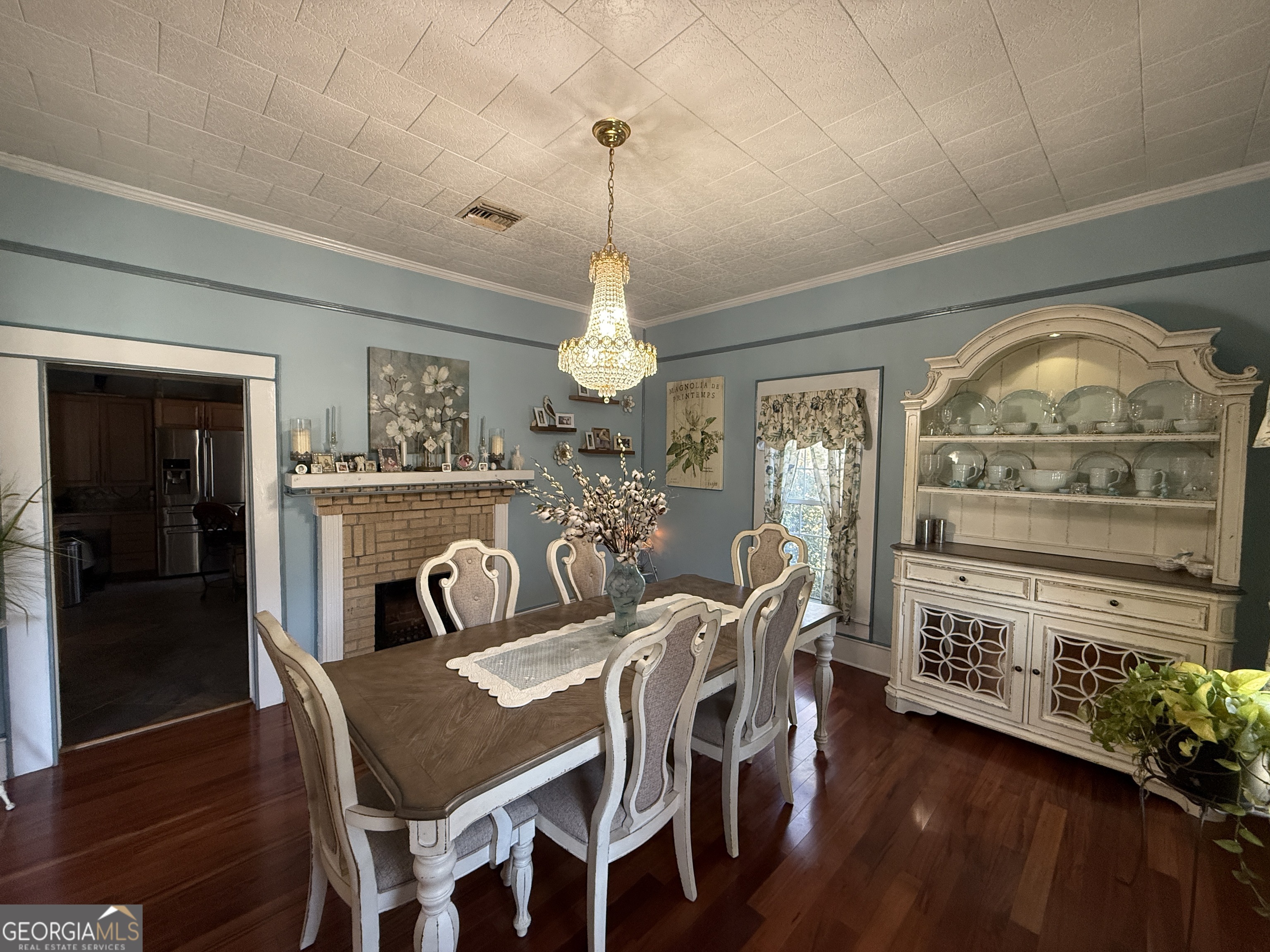 219 North College Street Pembroke, GA 31321 - Photo 4 of 24 a view of a dining room with furniture window and wooden floor
