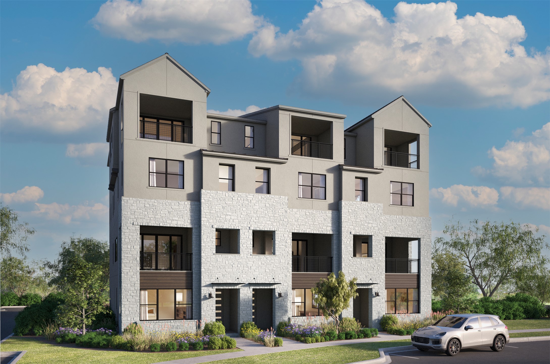 a front view of residential houses with cars parked