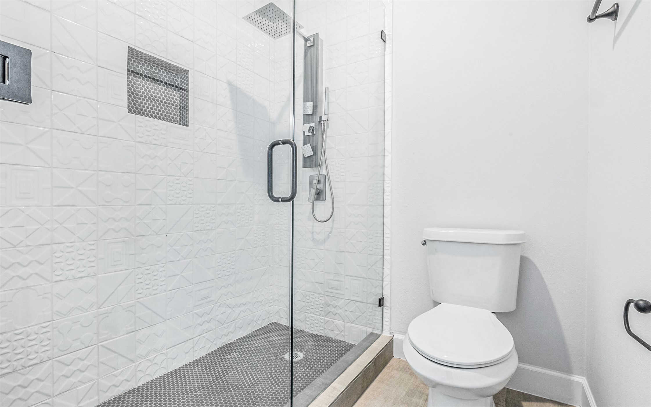 1130 Spur Street, Unit A Austin, TX 78721 - Photo 15 of 31 Primary bathroom with toilet and a shower stall