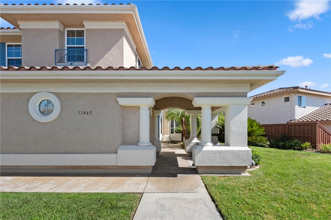 31465 Inverness Court Temecula, CA 92591 - Photo 7 of 75 Elegant two-story façade accented by classic shutters, columns and a tile roof.