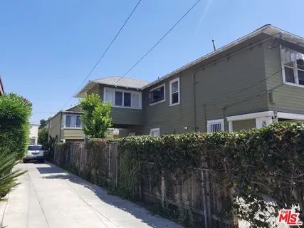 a view of a house and a yard