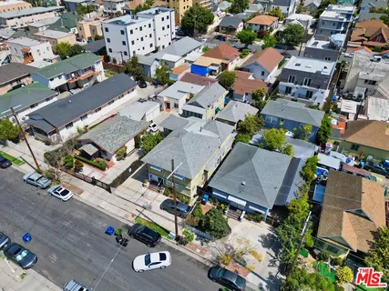an aerial view of a house with a yard