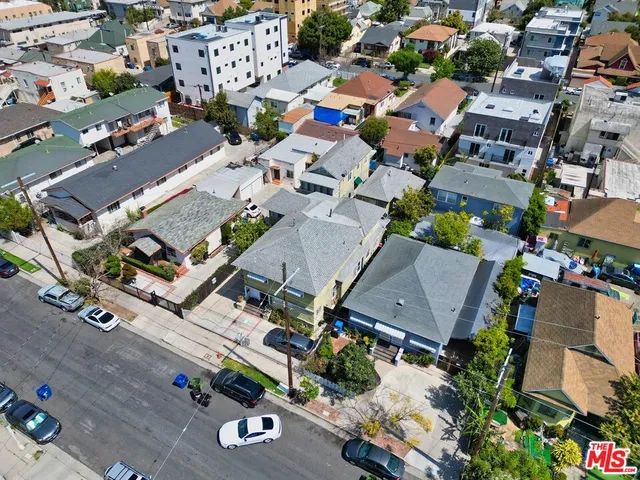 an aerial view of a house with a yard