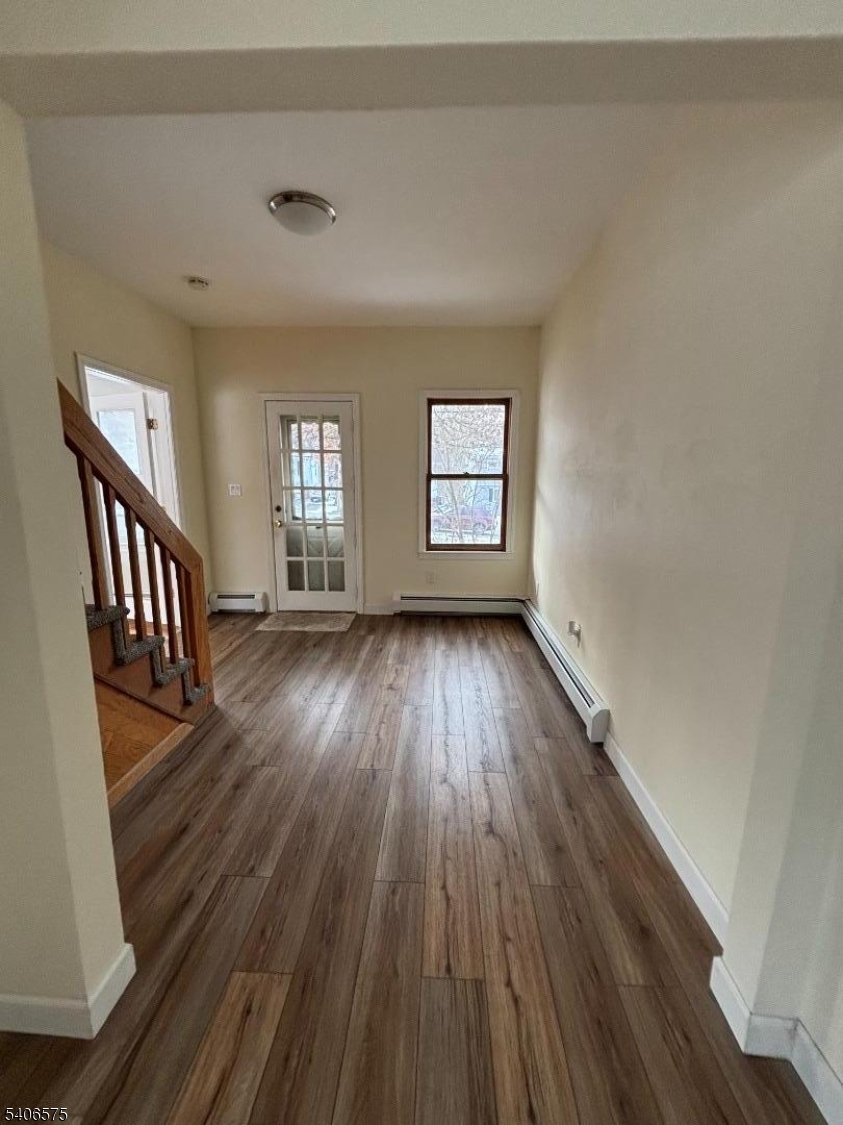 225 East Northfield Road Livingston, NJ 07039 - Photo 5 of 11 wooden floor in a hall with an entryway