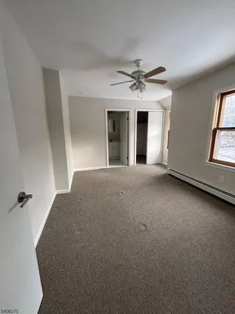 a view of a big room with windows and fireplace