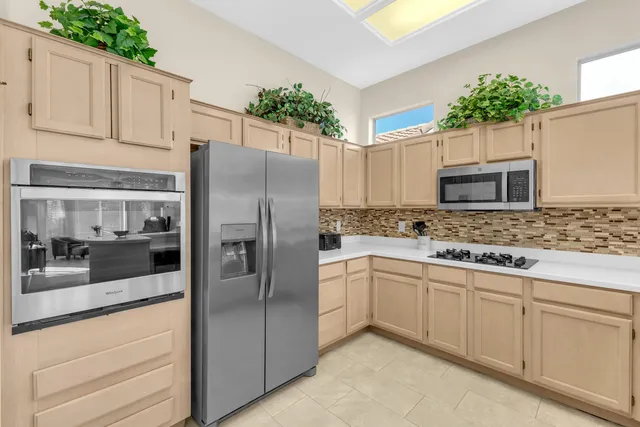 an entryway with wooden floor and cabinet