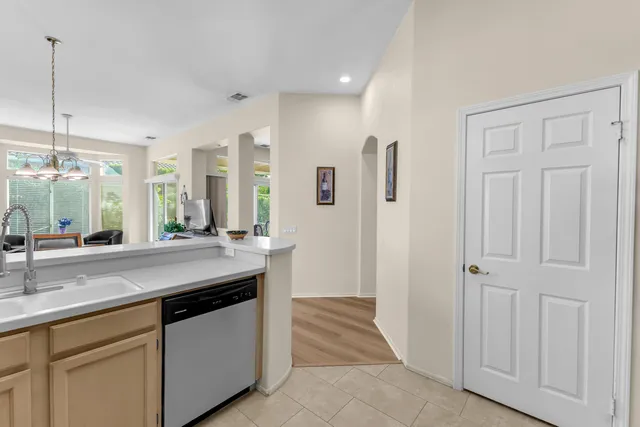 a view of a house with backyard porch and sitting area