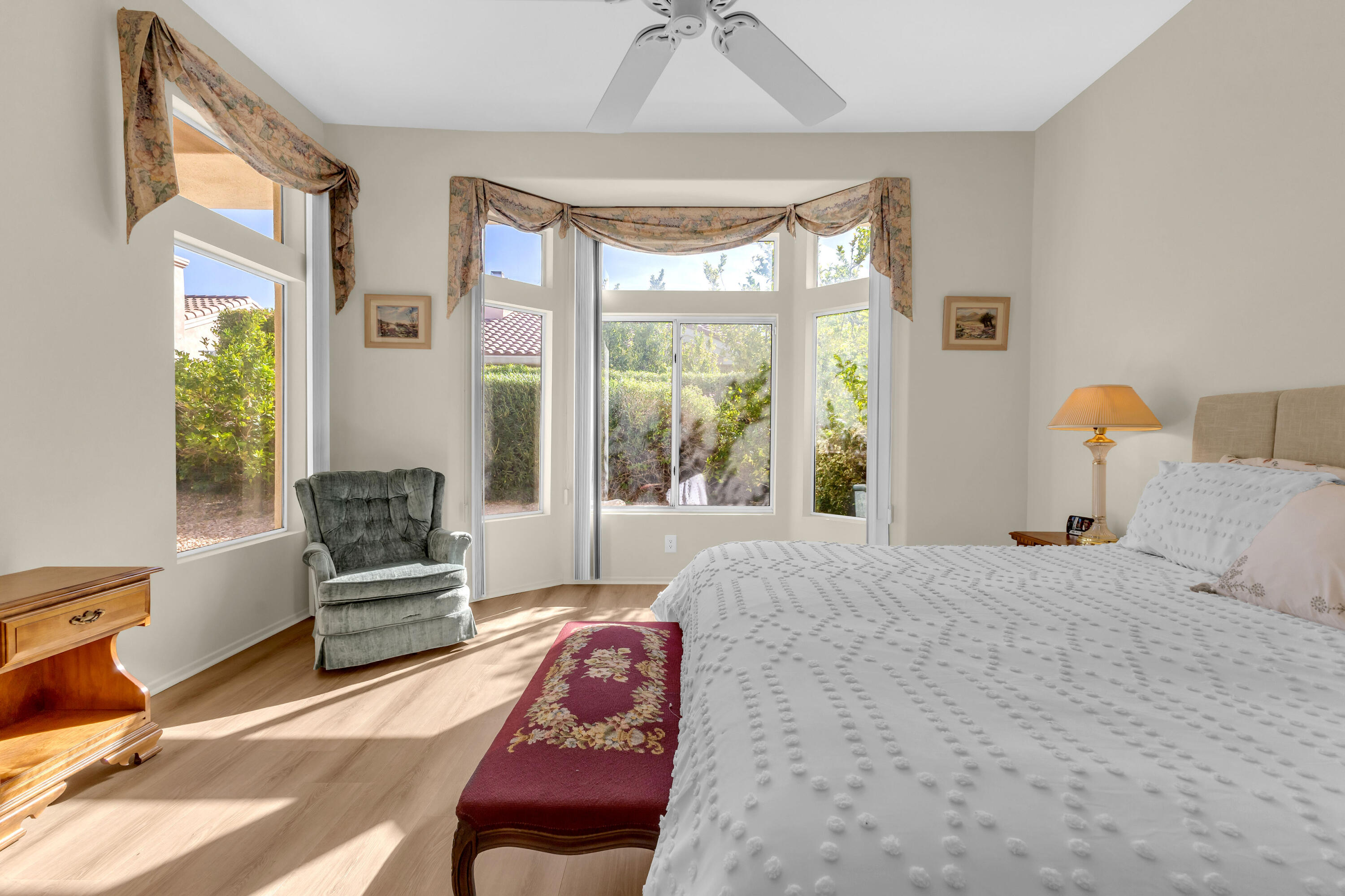 37468 Westridge Avenue Palm Desert, CA 92211 - Photo 21 of 40 a bedroom with a bed and wooden floor